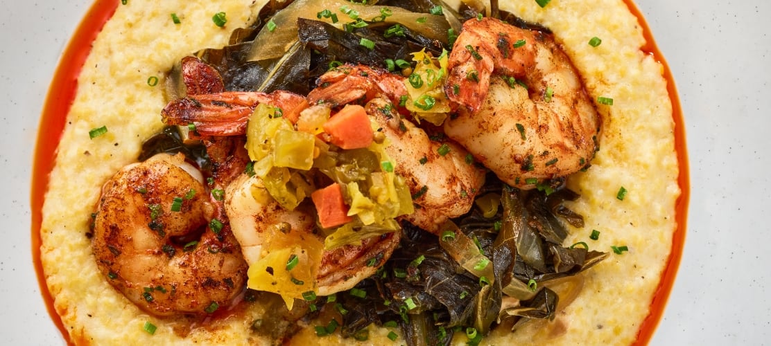 An elegant plating of shrimp and grist at the Untitled Nashville